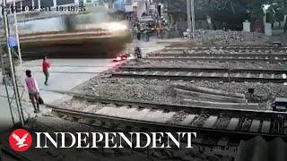 Biker narrowly avoids speeding train in Mumbai