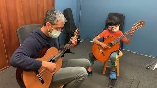 Rob Watson with Student playing May Song