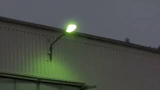 Wall mounted streetlight powers off during warm up.