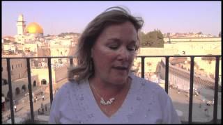 Jodi Faith prays a prayer from Womens Aglow International from the Western Wall in Israel