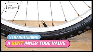 Straightening a bent tube valve on a bike wheel