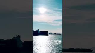 Seattle is a port city, with container ships coming and going from Port during a spring sunset.