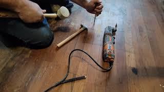 Replacing a damaged hardwood floor board in the middle of the floor.