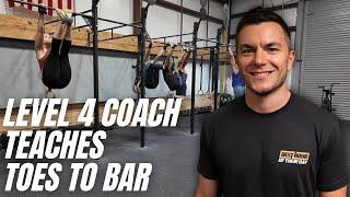 Watch How a Level 4 CrossFit Coach Teaches Toes-to-bar to a Class