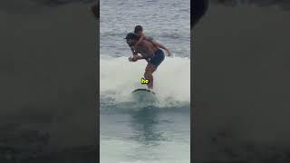 Dad Surfs with Son on His Back!