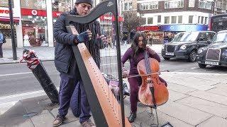 Harp and Cello Musicians in the Streets of London. Street Music