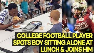 College Football Player Spots Boy Sitting Alone At Lunch & Joins Him