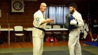 David Muscarella demonstrates 1-2 punch with front kick on focus bag