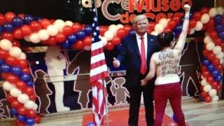 Topless Women protester grabs Trump by the balls! shouting "grab patriarchy by the balls!"