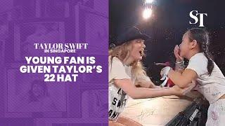 Taylor Swift in Singapore: Young fan is given Taylor's 22 hat