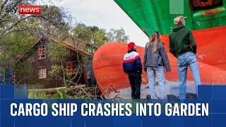 Man wakes up to find a container ship in his garden