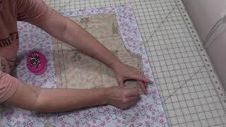 Cutting Out sewing pattern on fabric