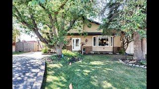 Fully finished walk up home in WOODHAVEN, Okotoks with a pool