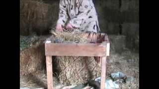 An easy and quick way to fill horse hay nets without tears