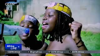 Ugandan youngsters use kitchen utensils to make music