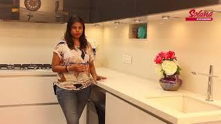 Lacquered Glass Finish 'L' shape Modular kitchen By Solana Kitchens