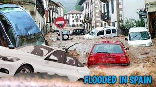 Dramatic moment cars are washed down road in Spain hit by horror floods