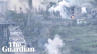 Drone footage shows artillery strikes on Ukrainian town since captured by Russia