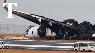 Destroyed Japan Airlines plane rests on Tokyo runway