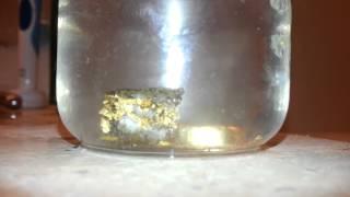 Vinegar dissolving Calcite? from a gold specimen