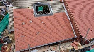 Starting tiling the roof and installing the roof windows