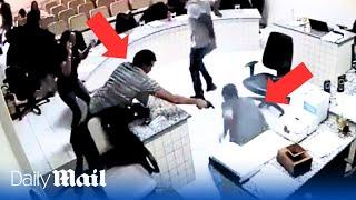 Brazilian gunman opens fire on his father’s ‘killer' in court room