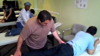 National Academy of Osteopathy Students Practicing Sacrum Muscle Energy Techniques