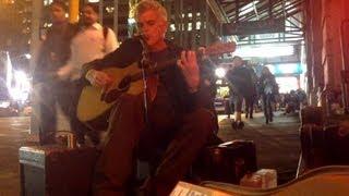 Luke Hurley busking on winter's night, Auckland City