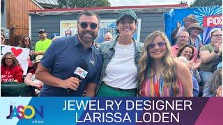 Jewelry designer Larissa Loden shows off her Fair-themed jewelry