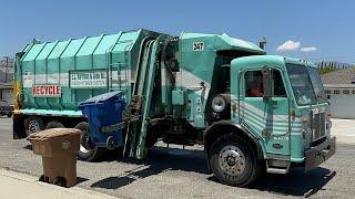 EJ Harrison Peterbilt Amrep Garbage Truck on Recycling Barrels