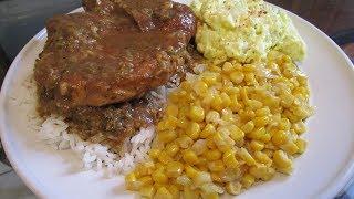 How to make Smothered Pork chops with brown gravy, rice, corn, and potato salad