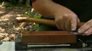 Ray Mears - How to sharpen an axe at camp, Bushcraft Survival