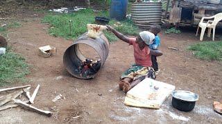 Traditional lavash bread: Baking bread on a barrel over a wood fire: village life of a poor mother