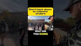 Cops form a line of intimidation