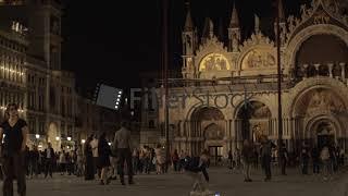 Crowded St. Marks Square in night Venice, Italy