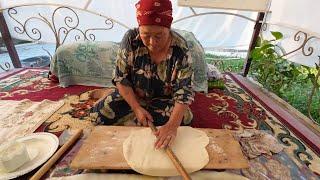 Kyrgyz lady making Borsok (fried puffed bread) the traditional way