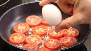 I have never eaten such delicious eggs. Fried eggs with tomatoes in a pan