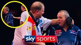 Watch the SHOCKING moment Phil Taylor CLASHES with Raymond Van Barneveld!