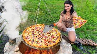 This video has 12 MILLION Views! Delicious Pizza in the Underground Tandoor