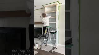 Completely custom DIY fireplace built-ins made from two affordable IKEA bookcases