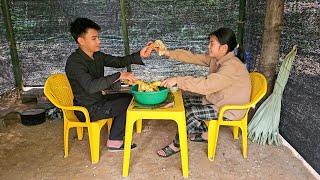 Homeless boy and girl use mesh as kitchen wall to buy chicken to cook - Homeless boy