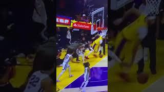 Lakers fan hits Grizzlies Player on court?? Then stands over him. Playoff (Watch slomo)