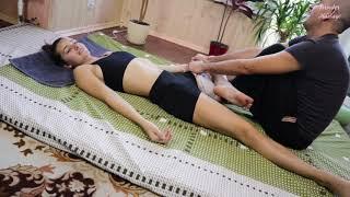 Thai massage. Foot massage, stretching legs