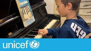 Music brings comfort to a child trapped by conflict in Ukraine | UNICEF