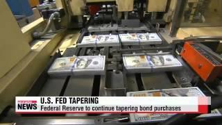 U.S. Fed continues to taper bond-buying program