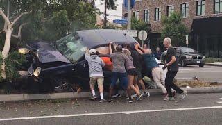 20 People Help Flip SUV to Free Those Trapped Inside