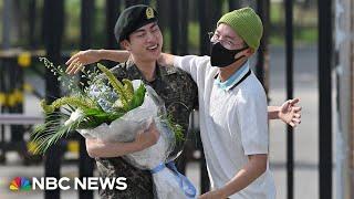 Jin greeted by BTS colleagues as he leaves South Korean army after national service