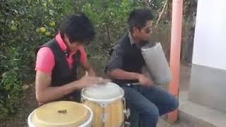 Percusión de guira y conga