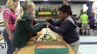 Fourth graders at Bashaw Elementary make sculptures out of fruits and veggies