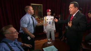 2009: Hugo Chavez sings with Larry King